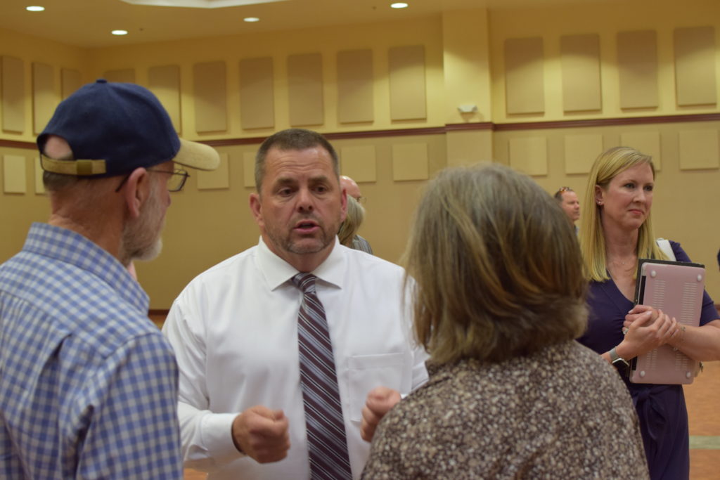 Ted Howze with community members