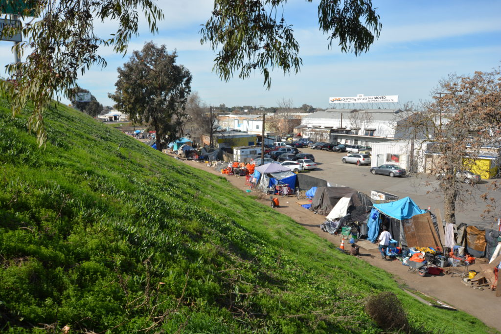 Homeless camp along Highway 99 near Bystrom