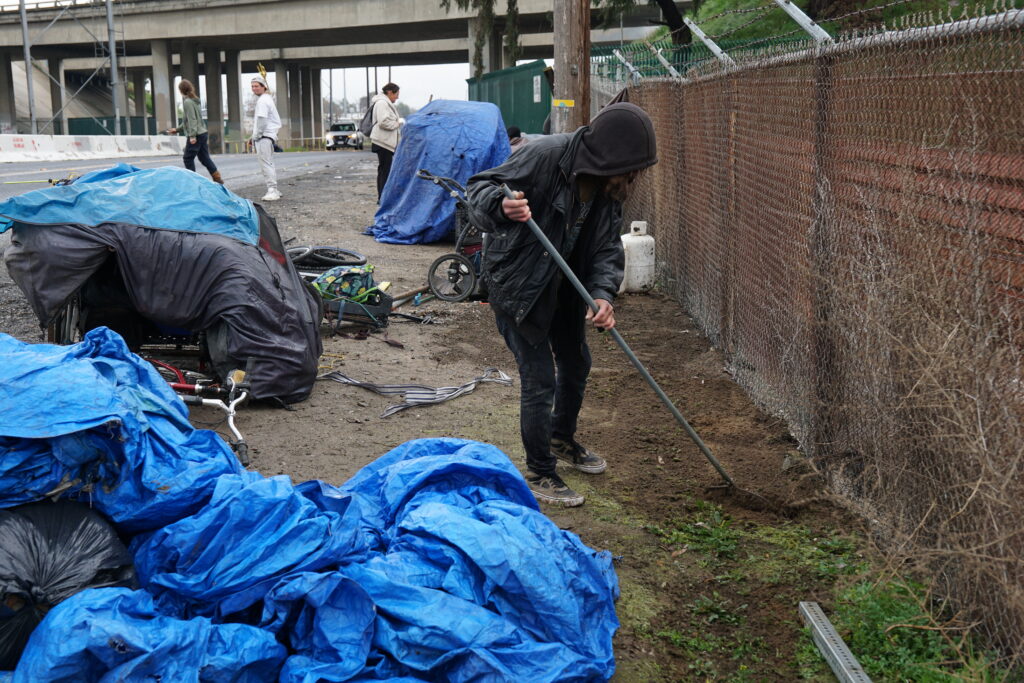 Sweeping up after forced move, Modesto, 5 March, 2025