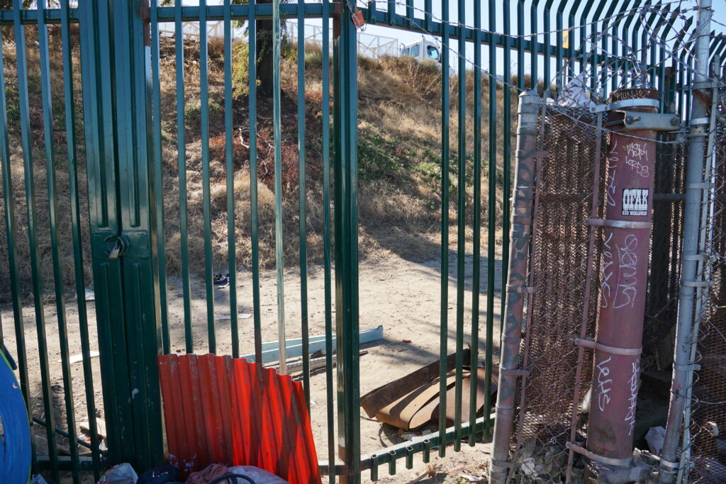Cut fence, Modesto near 7th Street, May, 2025